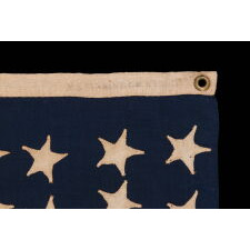 37 STAR ANTIQUE AMERICAN FLAG, MADE & SIGNED BY THE ANNIN COMPANY IN NEW YORK CITY, ENTIRELY HAND-SEWN AND WITH SINGLE-APPLIQUÉD STARS, IN A SMALL AND VERY DESIRABLE SCALE AMONG THOSE WITH PIECED-AND-SEWN CONSTRUCTION; REFLECTS THE ERA WHEN NEBRASKA WAS THE MOST RECENT STATE TO JOIN THE UNION, 1867-1876