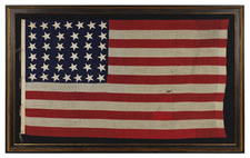 38 CANTED HAND-SEWN STARS AND HAND-SEWN STRIPES ON A FLAG IN A DESIRABLE SMALL SCALE FOR THE PERIOD, 1876-1889, COLORADO STATEHOOD