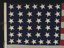38 CANTED HAND-SEWN STARS AND HAND-SEWN STRIPES ON A FLAG IN A DESIRABLE SMALL SCALE FOR THE PERIOD, 1876-1889, COLORADO STATEHOOD