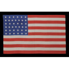 38 DANCING STARS ON A SILK ANTIQUE AMERICAN PARADE FLAG WITH GENEROUS SCALE AND VIVID COLORS, COLORADO STATEHOOD, 1876-1889