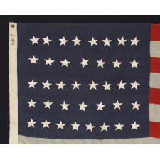 38 HAND-SEWN STARS STITCHED WITH BROWN THREAD TO A STEEL BLUE CANTON, AN ANTIQUE MERICAN FLAG WITH EXCEPTIONAL CONDITION, COLORADO STATEHOOD, 1876-1889