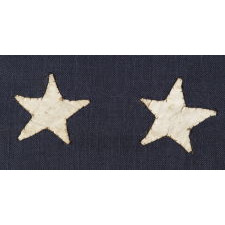 38 HAND-SEWN STARS STITCHED WITH BROWN THREAD TO A STEEL BLUE CANTON, AN ANTIQUE MERICAN FLAG WITH EXCEPTIONAL CONDITION, COLORADO STATEHOOD, 1876-1889
