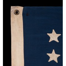 38 HAND-SEWN STARS IN AN UNUSUALLY CONFINED PATTERN OF JUSTIFIED ROWS, ON AN ANTIQUE FLAG IN AN ESPECIALLY SMALL SCALE FOR THE PERIOD, 1876-1889, COLORADO STATEHOOD
