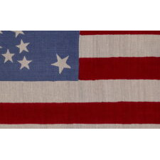 38 STAR AMERICAN PARADE FLAG WITH A RARE AND BEAUTIFUL VARIATION OF THE “GREAT STAR” OR “GREAT FLOWER” PATTERN, 4 LARGE CORNER STARS, & AN ODD OUTLIER, 1876-1889, COLORADO STATEHOOD, EXTRAORDINARILY RARE