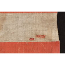38 STAR ANTIQUE AMERICAN FLAG WITH A TRIPLE-WREATH STYLE MEDALLION CONFIGURATION AND 2 OUTLIERS, ON A LARGE SCALE PARADE FLAG, 1876-1889, COLORADO STATEHOOD