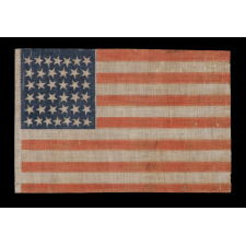 38 STAR ANTIQUE AMERICAN FLAG WITH SCATTERED STAR POSITIONING MADE DURING THE PERIOD WHEN COLORADO WAS THE MOST RECENT STATE TO JOIN THE UNION, 1876-1889