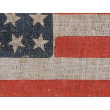 38 STAR ANTIQUE AMERICAN FLAG WITH SCATTERED STAR POSITIONING MADE DURING THE PERIOD WHEN COLORADO WAS THE MOST RECENT STATE ADDED TO THE UNION, 1876-1889