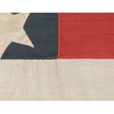38 STAR ANTIQUE AMERICAN FLAG WITH A DOUBLE-WREATH CONFIGURATION THAT FEATURES AN ENORMOUS CENTER STAR, REFLECTS THE PERIOD OF COLORADO STATEHOOD, 1876-1889