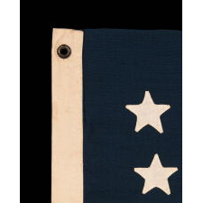 38 STAR ANTIQUE AMERICAN FLAG WITH HAND-SEWN STARS IN AN 8-7-8-7-8 PATTERN OF JUSTIFIED ROWS, MADE IN THE PERIOD WHEN COLORADO WAS THE MOST RECENT STATE TO JOIN THE UNION, 1876-1889