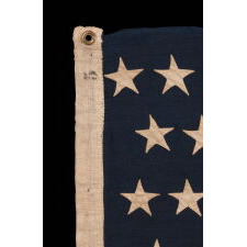 38 STAR ANTIQUE AMERICAN FLAG WITH BEAUTIFULLY HAND-SEWN STARS AND IN A SMALL AND VERY DESIRABLE SCALE AMONG ITS COUNTERPARTS OF THE 19TH CENTURY; REFLECTS THE PERIOD WHEN COLORADO WAS THE MOST RECENT STATE TO JOIN THE UNION, 1876-1889