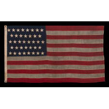 38 STAR ANTIQUE AMERICAN FLAG WITH BEAUTIFULLY HAND-SEWN STARS AND IN A SMALL AND VERY DESIRABLE SCALE AMONG ITS COUNTERPARTS OF THE 19TH CENTURY; REFLECTS THE PERIOD WHEN COLORADO WAS THE MOST RECENT STATE TO JOIN THE UNION, 1876-1889