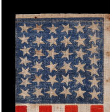 38 STAR ANTIQUE AMERICAN FLAG WITH SCATTERED STAR POSITIONING MADE DURING THE PERIOD WHEN COLORADO WAS THE MOST RECENT STATE TO JOIN THE UNION, 1876-1889