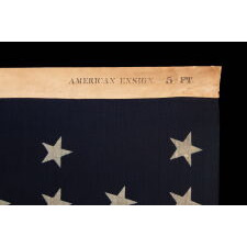 38 STAR ANTIQUE AMERICAN FLAG WITH A NOTCHED CONFIGURATION, MADE BY THE U.S. BUNTING COMPANY IN LOWELL, MASSACHUSETTS, REFLECTS THE ERA OF COLORADO STATEHOOD, circa 1876-1889