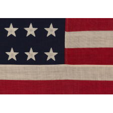 38 STAR ANTIQUE AMERICAN FLAG WITH A NOTCHED CONFIGURATION, MADE BY THE U.S. BUNTING COMPANY IN LOWELL, MASSACHUSETTS, REFLECTS THE ERA OF COLORADO STATEHOOD, circa 1876-1889