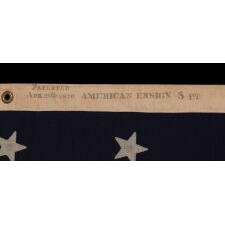 38 STAR ANTIQUE AMERICAN FLAG WITH A NOTCHED CONFIGURATION, MADE BY THE U.S. BUNTING COMPANY IN LOWELL, MASSACHUSETTS, REFLECTS THE ERA OF COLORADO STATEHOOD, circa 1876-1889