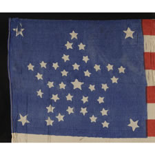 38 STAR ANTIQUE AMERICAN PARADE FLAG WITH A RARE AND BEAUTIFUL VARIATION OF THE "GREAT STAR" OR "GREAT FLOWER" AND AN ODD OUTLIER, 1876-1889, COLORADO STATEHOOD
