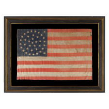 38 STAR ANTIQUE FLAG WITH A MEDALLION CONFIGURATION AND 2 OUTLIERS, ON A LARGE SCALE EXAMPLE MADE CIRCA 1876-1889, COLORADO STATEHOOD