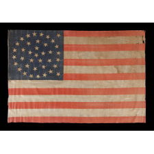 38 STAR ANTIQUE FLAG WITH A MEDALLION CONFIGURATION AND 2 OUTLIERS, ON A LARGE SCALE EXAMPLE MADE CIRCA 1876-1889, COLORADO STATEHOOD