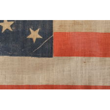 38 STAR ANTIQUE FLAG WITH A MEDALLION CONFIGURATION AND 2 OUTLIERS, ON A LARGE SCALE EXAMPLE MADE CIRCA 1876-1889, COLORADO STATEHOOD