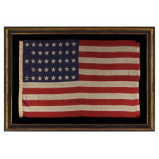 38 STAR ANTIQUE FLAG WITH A "NOTCHED" CONFIGURATION, ON A 5 ft. EXAMPLE OF THE 1876-1889 PERIOD, REFLECTS COLORADO STATEHOOD