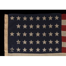 38 STAR ANTIQUE FLAG WITH A "NOTCHED" CONFIGURATION, ON A 5 ft. EXAMPLE OF THE 1876-1889 PERIOD, REFLECTS COLORADO STATEHOOD