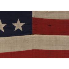 38 STAR ANTIQUE FLAG WITH A "NOTCHED" CONFIGURATION, ON A 5 ft. EXAMPLE OF THE 1876-1889 PERIOD, REFLECTS COLORADO STATEHOOD