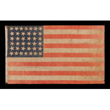 38 STAR ANTIQUE AMERICAN PARADE FLAG WITH JUSTIFIED ROWS OF 7-6-6-6-6-7 AND SCATTERED STAR ORIENTATION, MADE DURING THE PERIOD WHEN COLORADO WAS THE MOST RECENT STATE TO JOIN THE UNION, 1876-1889