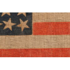 38 STAR ANTIQUE AMERICAN PARADE FLAG WITH JUSTIFIED ROWS OF 7-6-6-6-6-7 AND SCATTERED STAR ORIENTATION, MADE DURING THE PERIOD WHEN COLORADO WAS THE MOST RECENT STATE TO JOIN THE UNION, 1876-1889