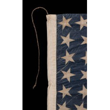 38 STAR ANTIQUE AMERICAN PARADE FLAG IN AN UNUSUALLY LARGE SCALE, WITH ENDEARING WAR FROM OBVIOUS LONG-TERM USE, AND WITH DANCING ROWS IN AN HOURGLASS FORMATION; COLORADO STATEHOOD, 1876-1889