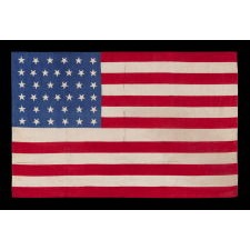 38 STAR FLAG WITH "DANCING" OR "TUMBLING" STARS, MADE OF SILK, WITH GENEROUS SCALE AND VIVID COLORS, COLORADO STATEHOOD, 1876-1889