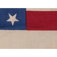 38 STAR FLAG WITH "DANCING" OR "TUMBLING" STARS, MADE OF SILK, WITH GENEROUS SCALE AND VIVID COLORS, COLORADO STATEHOOD, 1876-1889