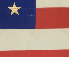 38 STAR FLAG WITH GILT-PAINTED STARS IN A MEDALLION CONFIGURATION, AN INDIAN WARS ERA BATTLE FLAG, 1876-1889, COLORADO STATEHOOD, HAND-SEWN SILK WITH GOLD FRINGE