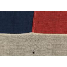 38 STAR FLAG WITH HAND-SEWN STARS, IN AN UNUSUALLY CONFINED PATTERN OF JUSTIFIED ROWS, ON AN ANTIQUE FLAG IN A SMALL SCALE FOR THE PERIOD, 1876-1889, COLORADO STATEHOOD
