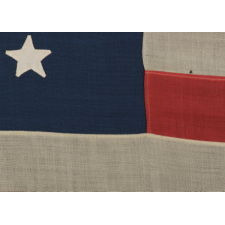 38 STAR FLAG WITH HAND-SEWN STARS, IN AN UNUSUALLY CONFINED PATTERN OF JUSTIFIED ROWS, ON AN ANTIQUE AMERICAN FLAG IN A SMALL SCALE FOR THE PERIOD, 1876-1889, COLORADO STATEHOOD