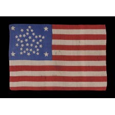 38 STAR FLAG WITH A RARE AND BEAUTIFUL VARIATION OF THE "GREAT STAR" PATTERN THAT FEATURES 4 OUTLIERS AND A STAR BETWEEN EACH ARM, EXCEPT IN ONE LOCATION, LEAVING ROOM FOR A 39TH TO BE ADDED; MADE IN THE PERIOD WHEN COLORADO WAS THE MOST RECENT STATE TO JOIN THE UNION, 1876-1889
