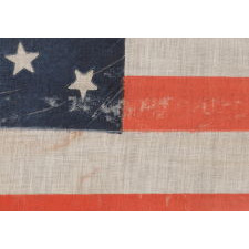 38 STARS IN A BEAUTIFUL MEDALLION CONFIGURATION WITH 2 OUTLIERS, ON A LARGE SCALE ANTIQUE AMERICAN PARADE FLAG OF THE 1876-1889 ERA, COLORADO STATEHOOD