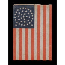 38 STARS IN A BEAUTIFUL MEDALLION CONFIGURATION WITH 2 OUTLIERS, ON AN ANTIQUE AMERICAN FLAG OF THE 1876-1889 ERA, COLORADO STATEHOOD