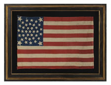 38 STARS, COLORADO STATEHOOD, A RARE MEDALLION PATTERN FLAG WITH 4 LARGE CORNER STARS, MADE FOR THE 1876 CENTENNIAL OF OUR NATION'S INDEPENDENCE, PRESS-DYED ON WOOL BUNTING