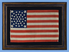 38 STARS, COLORADO STATEHOOD, A RARE, MEDALLION PATTERN FLAG WITH 4 HUGE CORNER STARS, MADE FOR THE 1876 CENTENNIAL OF OUR NATION'S INDEPENDENCE, PRESS-DYED ON WOOL BUNTING