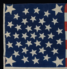 38 STARS, COLORADO STATEHOOD, A RARE, MEDALLION PATTERN FLAG WITH 4 HUGE CORNER STARS, MADE FOR THE 1876 CENTENNIAL OF OUR NATION'S INDEPENDENCE, PRESS-DYED ON WOOL BUNTING