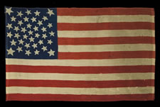 38 STARS, COLORADO STATEHOOD, A VERY RARE MEDALLION PATTERN FLAG WITH 4 LARGE CORNER STARS, MADE FOR THE 1876 CENTENNIAL