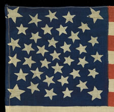 38 STARS, COLORADO STATEHOOD, A VERY RARE MEDALLION PATTERN FLAG WITH 4 LARGE CORNER STARS, MADE FOR THE 1876 CENTENNIAL
