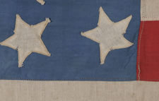38 STARS ON A CORNFLOWER BLUE CANTON, IN A MEDALLION CONFIGURATION, WITH A RARE GROUPING OF 3 STARS IN EACH CORNER, 1876-1889, COLORADO STATEHOOD