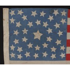 38 STARS ON A CORNFLOWER BLUE CANTON, IN A MEDALLION CONFIGURATION, WITH A RARE GROUPING OF 3 STARS IN EACH CORNER, 1876-1889, COLORADO STATEHOOD