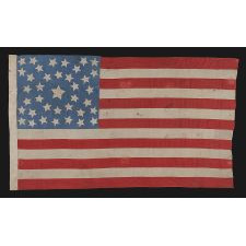 38 STARS ON A CORNFLOWER BLUE CANTON, IN A MEDALLION CONFIGURATION, WITH A RARE GROUPING OF 3 STARS IN EACH CORNER, 1876-1889, COLORADO STATEHOOD