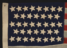 38 STARS IN DANCING ROWS ON A FLAG IN AN ESPECIALLY DESIRABLE SMALL SIZE FOR THE PERIOD, 1876-1889, COLORADO STATEHOOD