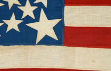 38 STARS IN A DOUBLE-WREATH WITH A HUGE CENTER STAR, WITH A BRILLIANT ROYAL BLUE CANTON, ON A SEWN FLAG WITH ESPECIALLY SMALL SCALE FOR THE 19TH CENTURY, 1876-1889, COLORADO STATEHOOD