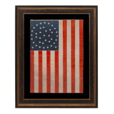 38 STARS IN AN EXCEPTIONALLY RARE “GREAT-STAR-IN-A-WREATH” CONFIGURATION, 1876-1889, REFLECTS THE ADMISSION OF COLORADO AS THE CENTENNIAL STATE