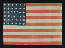 38 STARS IN AN EXTREMELY RARE LINEAL CONFIGURATION THAT HAS 4 TINY STARS EMBEDDED IN THE PATTERN, 1876-1889, COLORADO STATEHOOD
