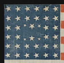 38 STARS IN AN EXTREMELY RARE LINEAL CONFIGURATION THAT HAS 4 TINY STARS EMBEDDED IN THE PATTERN, 1876-1889, COLORADO STATEHOOD